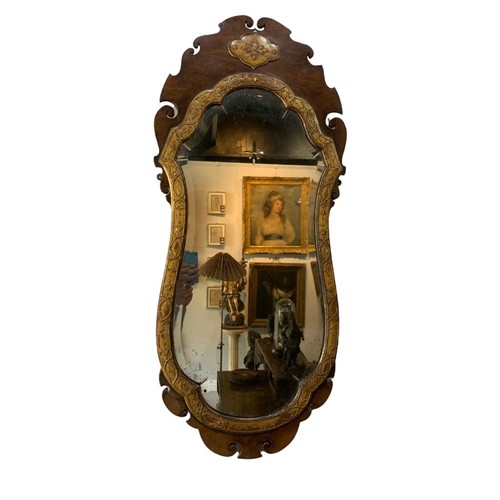 168 - A PAIR OF GEORGE III FLAME MAHOGANY AND PARCEL GILT WALL MIRROR
The central cartouche and scrolling ... 