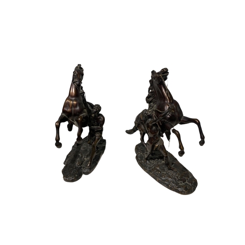 143 - AFTER COUSTOU, GUILLAUME, 1677 - 1746, A PAIR OF FRENCH PATINATED BRONZE GROUPS OF THE MARLY HORSES
... 