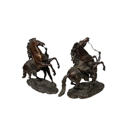 143 - AFTER COUSTOU, GUILLAUME, 1677 - 1746, A PAIR OF FRENCH PATINATED BRONZE GROUPS OF THE MARLY HORSES
... 