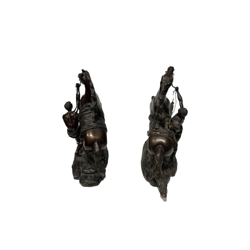 143 - AFTER COUSTOU, GUILLAUME, 1677 - 1746, A PAIR OF FRENCH PATINATED BRONZE GROUPS OF THE MARLY HORSES
... 