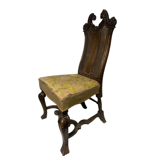 144 - A 19TH CENTURY CARVED WALNUT QUEEN ANNE DESIGN SIDE CHAIR
The scrolling cane back decorated with swa... 