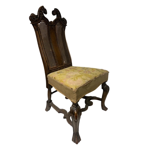 144 - A 19TH CENTURY CARVED WALNUT QUEEN ANNE DESIGN SIDE CHAIR
The scrolling cane back decorated with swa... 