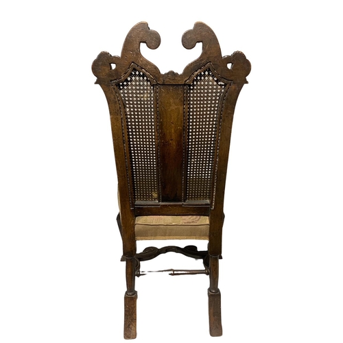 144 - A 19TH CENTURY CARVED WALNUT QUEEN ANNE DESIGN SIDE CHAIR
The scrolling cane back decorated with swa... 