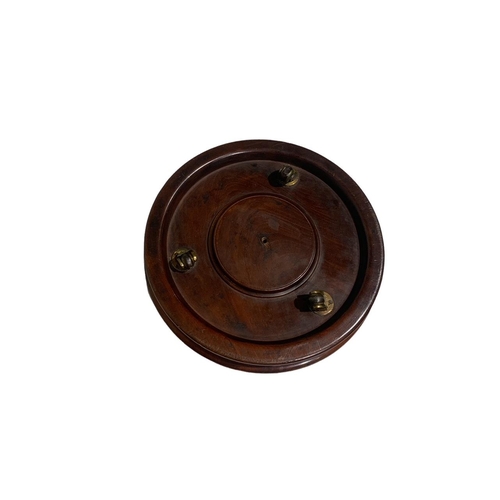 156 - AN EARLY 19TH CENTURY CIRCULAR SOLID FLAME MAHOGANY CHEESE COASTER
Raised on three brass casters.
(h... 