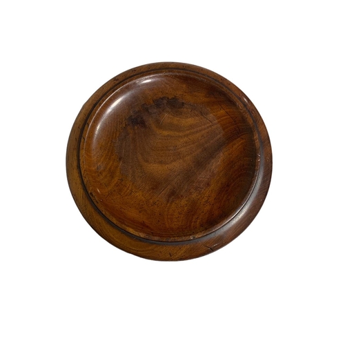 156 - AN EARLY 19TH CENTURY CIRCULAR SOLID FLAME MAHOGANY CHEESE COASTER
Raised on three brass casters.
(h... 