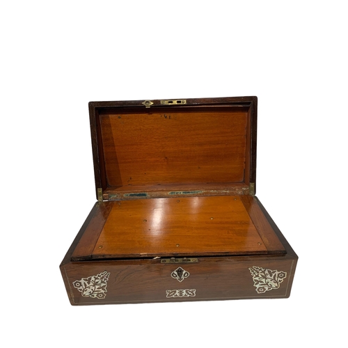 157 - A 19TH CENTURY ROSEWOOD TRAVELLING WRITING SLOPE
Having inlaid mother of pearl motifs.
(w 40.2cm x d... 