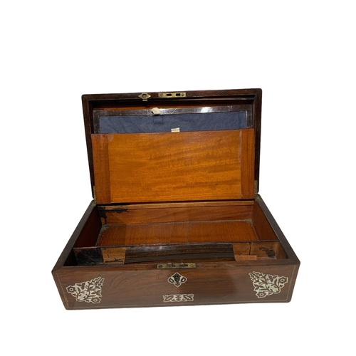 157 - A 19TH CENTURY ROSEWOOD TRAVELLING WRITING SLOPE
Having inlaid mother of pearl motifs.
(w 40.2cm x d... 