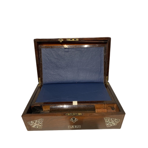 157 - A 19TH CENTURY ROSEWOOD TRAVELLING WRITING SLOPE
Having inlaid mother of pearl motifs.
(w 40.2cm x d... 