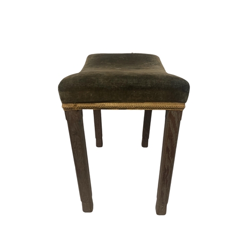 164 - A GEORGE VI OAK CORONATION STOOL
Upholstered in green plush saddle seat, on square section legs, sta... 