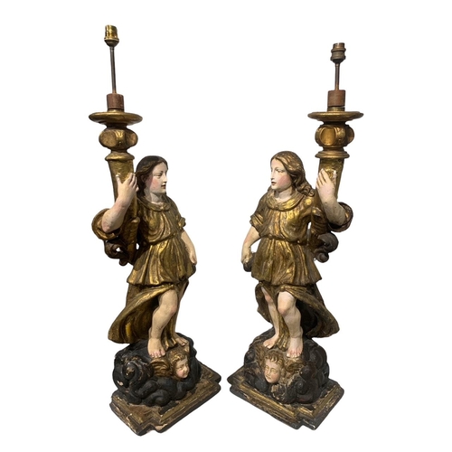 170 - A LARGE PAIR OF 17TH/18TH CENTURY ITALIAN CARVED GILTWOOD AND POLYCHROME STATUES
Depicting angels ho... 