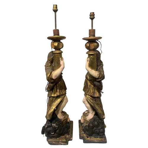 170 - A LARGE PAIR OF 17TH/18TH CENTURY ITALIAN CARVED GILTWOOD AND POLYCHROME STATUES
Depicting angels ho... 