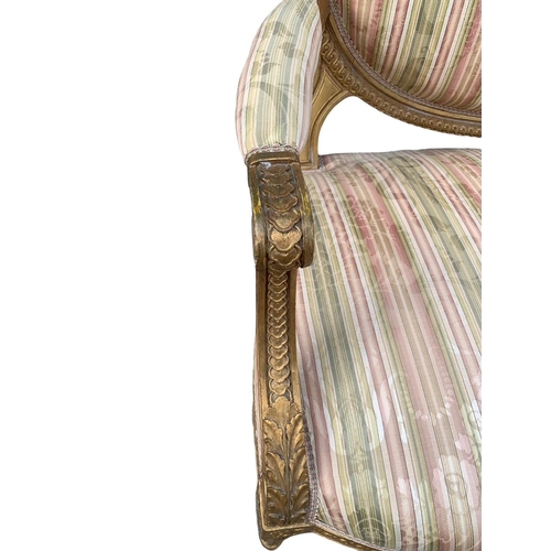 174 - AN 18TH/19TH CENTURY LOUIS XV DESIGN GILTWOOD SETTEE
The carved padded back above scrolling arms and... 