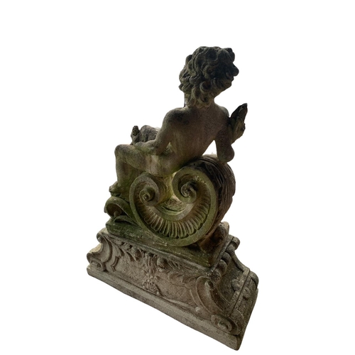 180 - A 19TH CENTURY RECONSTITUTED MARBLE STATUE, PUTTI HOLDING A WHEATSHEAF RECLINING
On an acanthus leaf... 