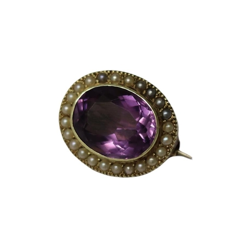 9 - MURRLE BENNETT & CO., A VICTORIAN 15CT GOLD, LARGE OVAL CUT AMETHYST AND SEED PEARL BROOCH
Surrounde... 