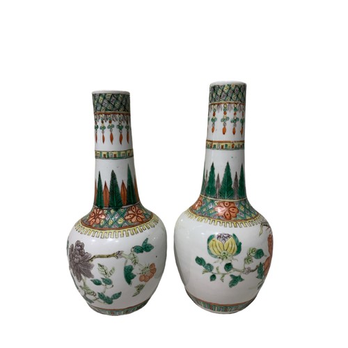 91 - A MATCHED PAIR OF 19TH CENTURY CHINESE FAMILLE ROSE BOTTLE FORM VASES
Decorated with pheasants among... 