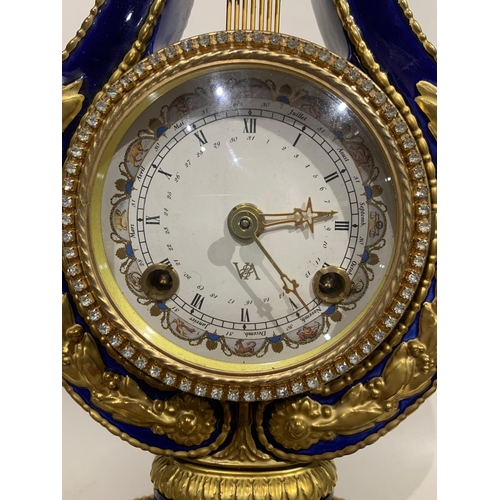 64 - A LOUIS VXI STYLE POTTERY AND GILT METAL MOUNTED LYRE CLOCK
Striking on bell, white dial inscribed V... 