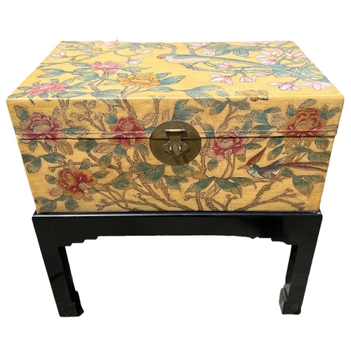 240 - A 20TH CENTURY JAPANESE PAINTED LEATHER CAMPHOR WOOD TRUNK ON EBONISED STAND
Decorated with a parrot... 