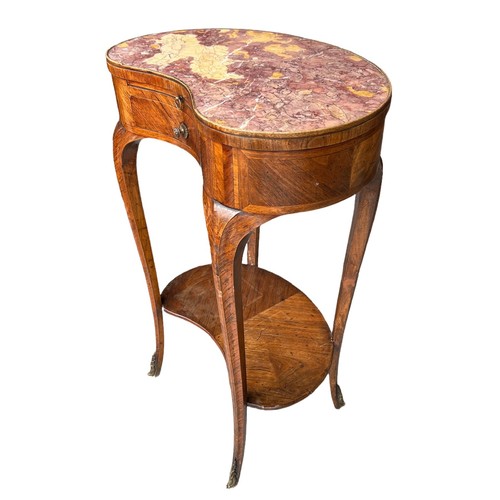 126 - AN 18TH CENTURY FRENCH KIDNEY SHAPED SIDE TABLE
The rouge inset top above slide and drawers, on cabr... 