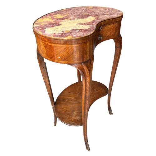 126 - AN 18TH CENTURY FRENCH KIDNEY SHAPED SIDE TABLE
The rouge inset top above slide and drawers, on cabr... 