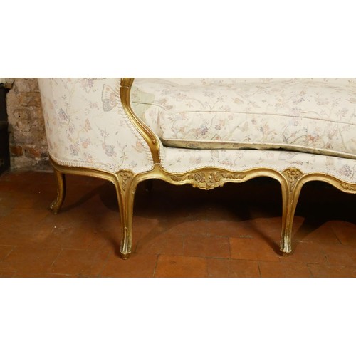 132 - MANNER OF ETIENNE MEUNIER, AN 18TH CENTURY LOUIS XV CARVED GILTWOOD CANAPÉ EN CORBEILLE SETTEE 
The ... 