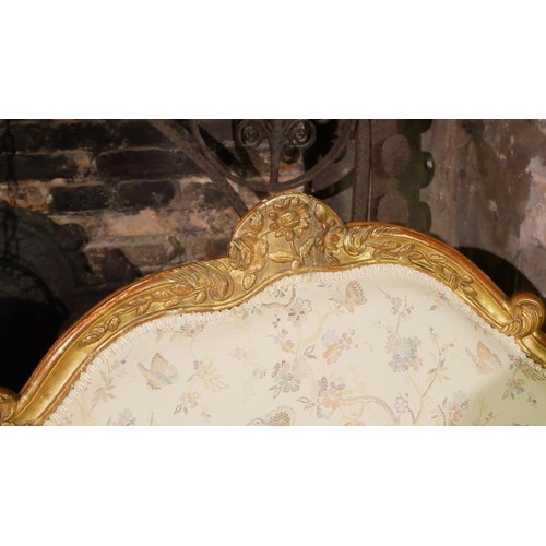 132 - MANNER OF ETIENNE MEUNIER, AN 18TH CENTURY LOUIS XV CARVED GILTWOOD CANAPÉ EN CORBEILLE SETTEE 
The ... 