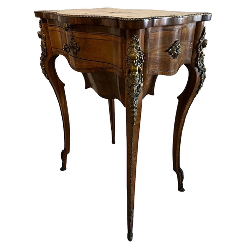 134 - A 19TH CENTURY WALNUT SIDE/WORK TABLE
The cartouche top white metal inlays centrally in the form of ... 