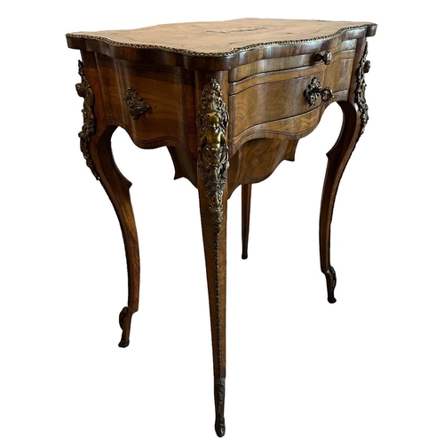 134 - A 19TH CENTURY WALNUT SIDE/WORK TABLE
The cartouche top white metal inlays centrally in the form of ... 