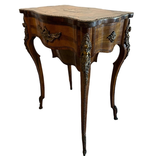 134 - A 19TH CENTURY WALNUT SIDE/WORK TABLE
The cartouche top white metal inlays centrally in the form of ... 