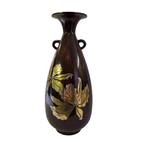 206 - A MID 20TH CENTURY BROWN LUSTRE PATINATED BRONZE BALUSTER VASE
Twin handled, one side inlaid with si... 