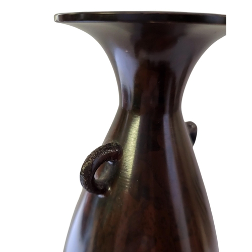 206 - A MID 20TH CENTURY BROWN LUSTRE PATINATED BRONZE BALUSTER VASE
Twin handled, one side inlaid with si... 