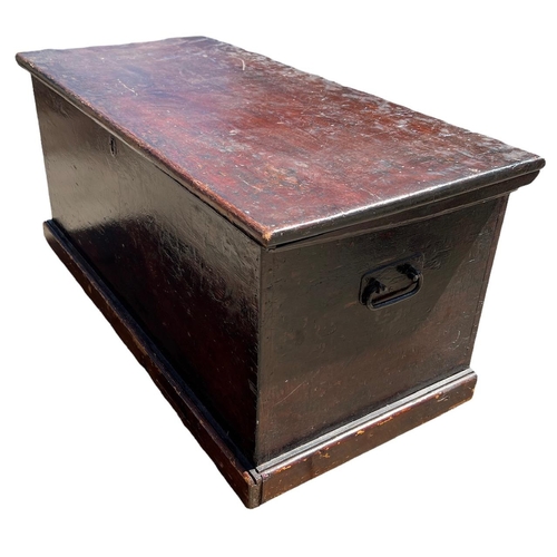 146 - A 19TH CENTURY PAINTED PINE TRUNK with hinge lid opening to reveal a candle box and two drawers rais... 