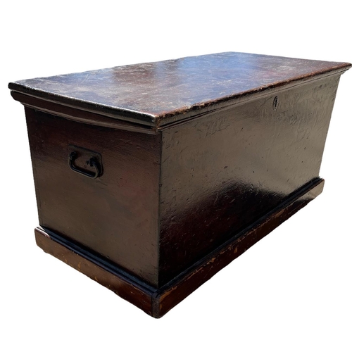 146 - A 19TH CENTURY PAINTED PINE TRUNK with hinge lid opening to reveal a candle box and two drawers rais... 