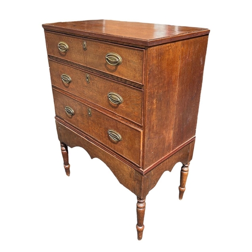 104 - AN 18TH CENTURY OAK CHEST ON STAND
With three drawers fitted with brass handles, raised on four turn... 