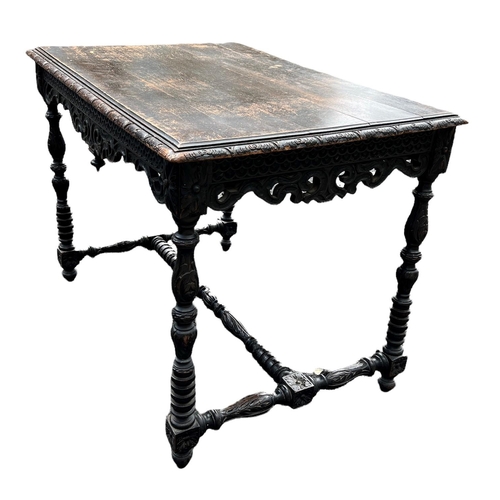 108 - A 19TH CENTURY CONTINENTAL CARVED OAK SIDE TABLE
The plank top above a priced and carved frieze, rai... 