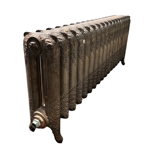 254 - A LARGE LOW FLOORSTANDING EIGHTEEN BAR ART NOUVEAU CAST IRON RADIATOR 
Decorated with stylised scrol... 