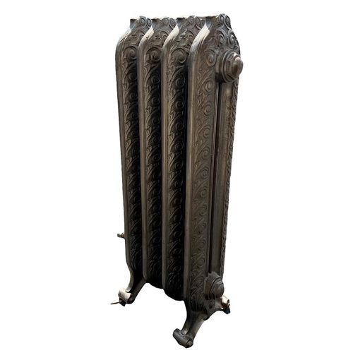 256 - A LARGE FLOORSTANDING FOUR BAR ART NOUVEAU CAST IRON RADIATOR 
Decorated with stylised scrolling lea... 