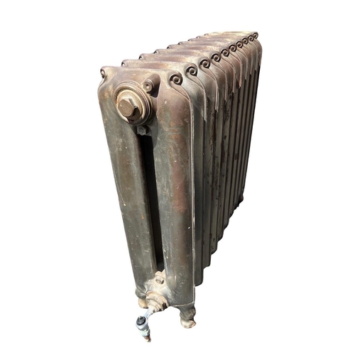 258 - A LARGE FLOORSTANDING TEN BAR ART NOUVEAU CAST IRON RADIATOR 
Decorated with stylised scrolls.
(h 69... 