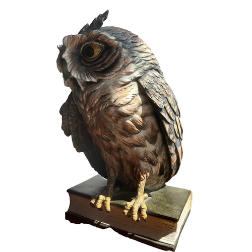 270 - GUIDO CACCIAPUOTI, ITALIAN, 1892 - 1953, A LARGE PORCELAIN OWL PERCHED ON A BOOK
Signed on spine.
(h... 