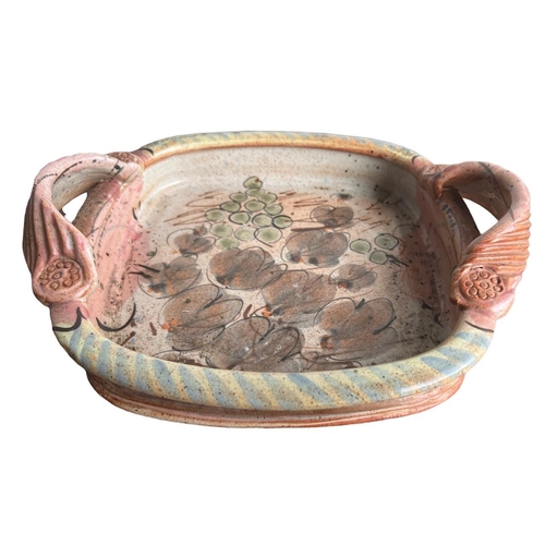 278 - WILLIE CARTER, B. 1952, A STUDIO POTTERY TWIN HANDLED TRAY
Decorated with grapes and vines, bearing ... 