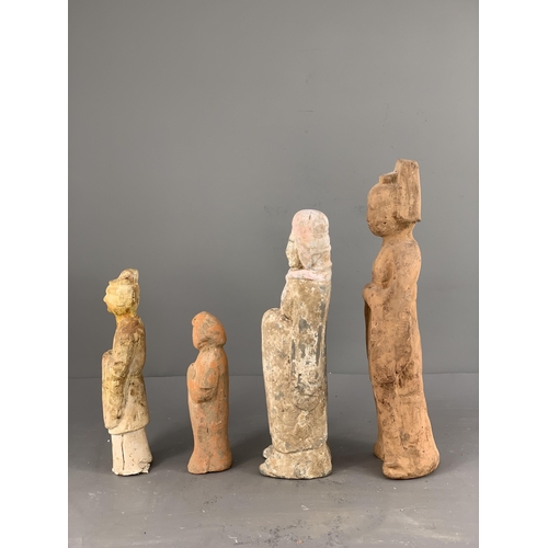 293 - A GROUP OF FOUR POTTERY FIGURES, 4TH/5TH CENTURY
Including three figures of officials, one of them s... 