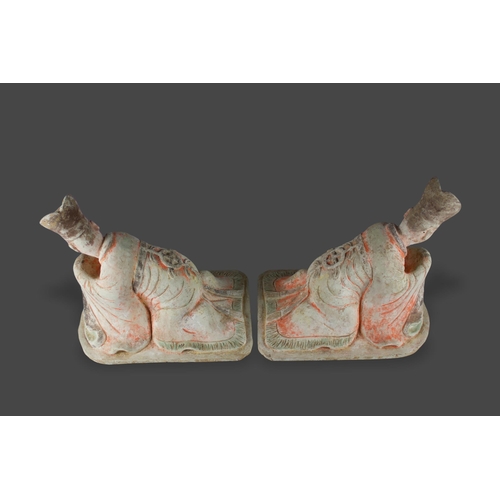 297 - A large pair of pottery Figures of kneeling Courtiers, Tang dynasty, AD 618 - 907

L: 38cm

PROPERTY... 