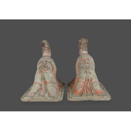 297 - A large pair of pottery Figures of kneeling Courtiers, Tang dynasty, AD 618 - 907

L: 38cm

PROPERTY... 