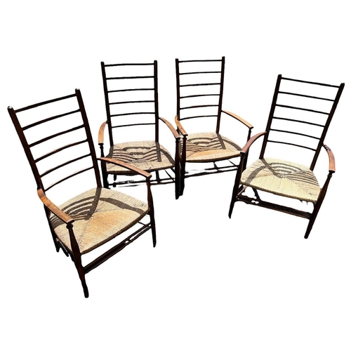 106 - LIBERTY & CO. ARTS & CRAFTS, A SET OF FOUR LOW LADDER BACK ARMCHAIRS 
With rush seats.
 
N.B. an ima... 