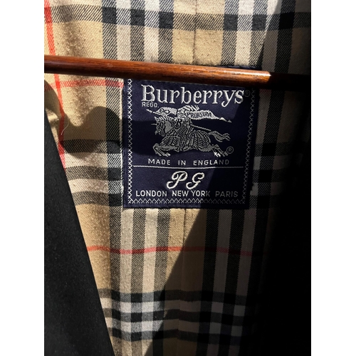 117A - BURBERRY, A LONG BELTED TRENCH COAT.
(size M)