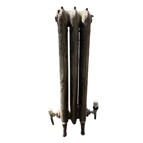 252 - A LARGE FLOORSTANDING THREE BAR ART NOUVEAU CAST IRON RADIATOR 
Decorated with stylised scrolling le... 