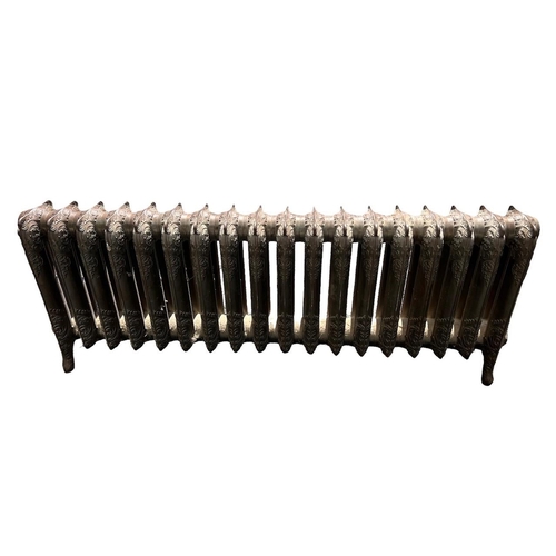 254 - A LARGE LOW FLOORSTANDING EIGHTEEN BAR ART NOUVEAU CAST IRON RADIATOR 
Decorated with stylised scrol... 