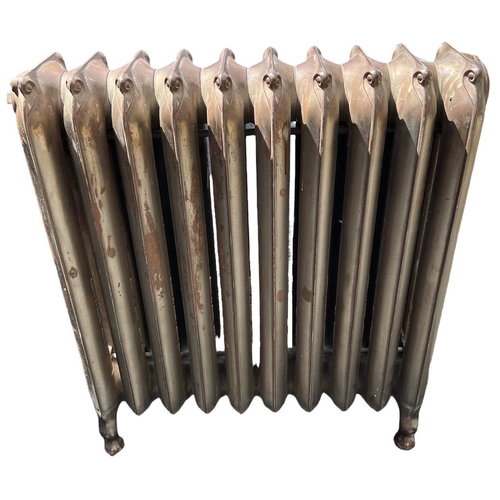 258 - A LARGE FLOORSTANDING TEN BAR ART NOUVEAU CAST IRON RADIATOR 
Decorated with stylised scrolls.
(h 69... 