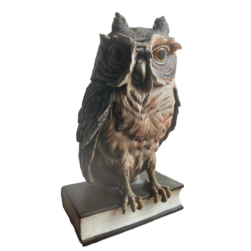 270 - GUIDO CACCIAPUOTI, ITALIAN, 1892 - 1953, A LARGE PORCELAIN OWL PERCHED ON A BOOK
Signed on spine.
(h... 