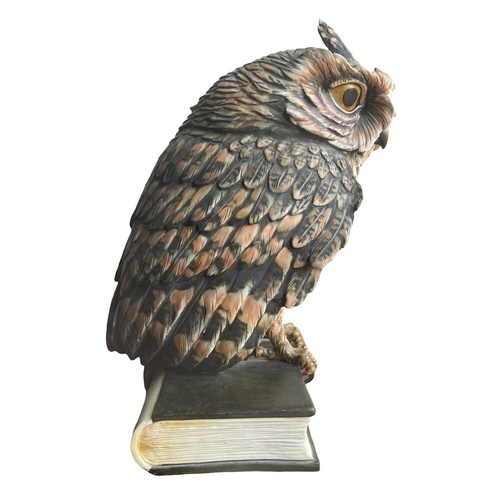 270 - GUIDO CACCIAPUOTI, ITALIAN, 1892 - 1953, A LARGE PORCELAIN OWL PERCHED ON A BOOK
Signed on spine.
(h... 