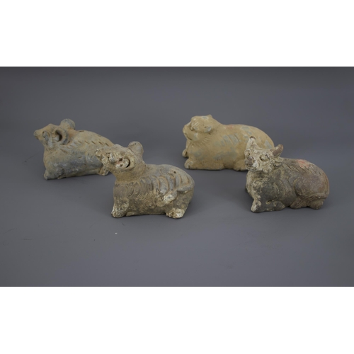 279 - A RARE GROUP OF TWELVE POTTERY ZODIAC ANIMALS, YUAN DYNASTY, AD. 1279 – 1368
Each grey pottery figur... 